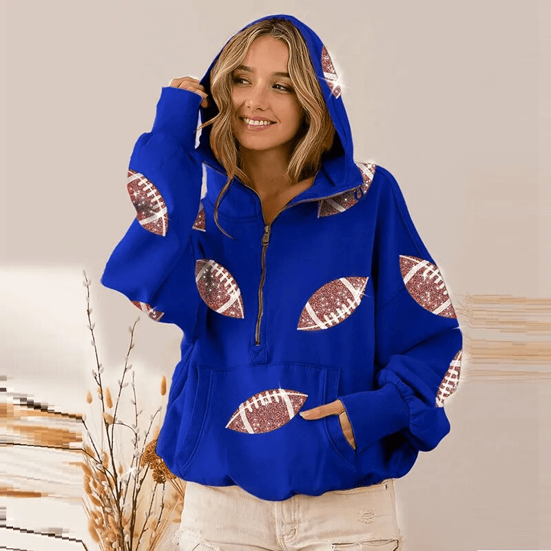 Woman wearing a sporty casual women's hoodie with football print, front pockets, and hood, SF1598, in a cozy blue color.